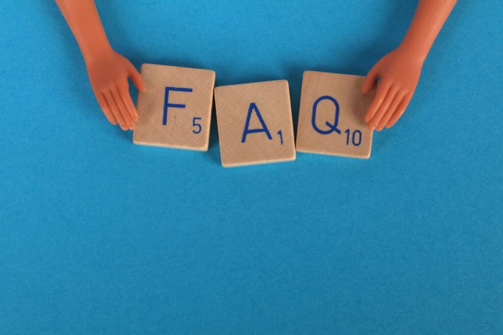 close up shot of scrabble tiles on a blue surface